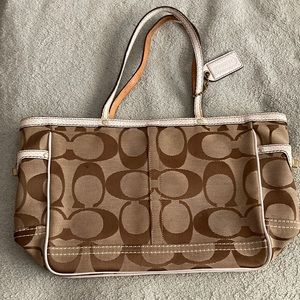 White and brown coach purse